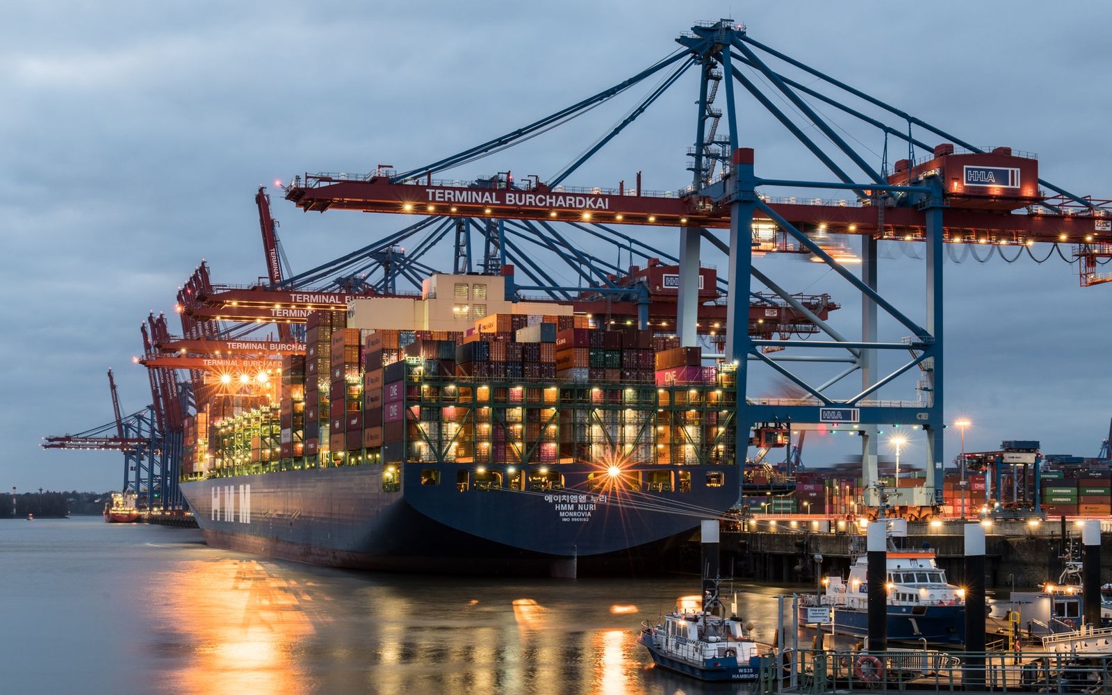 Shipping containers being moved at a port